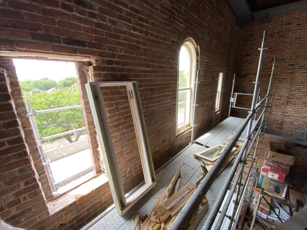 picture of a Window Frame Ready for a Carpenter to Install it Into a Hole in the Wall